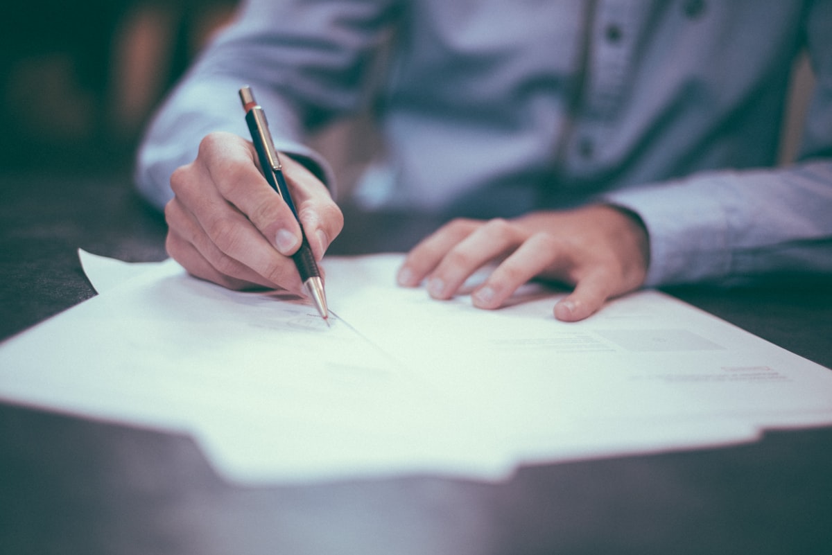 Person reviewing mortgage documents at a desk representing loan officer transparency