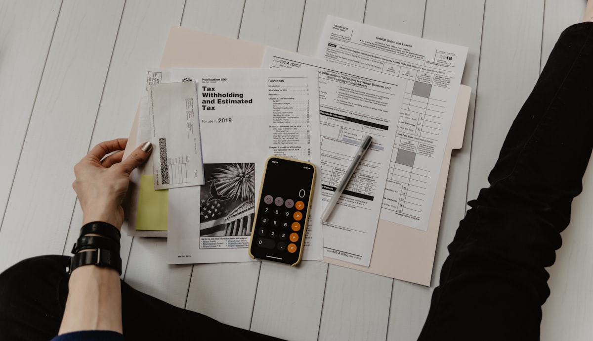 Financial documents and calculator representing mortgage rate comparison shopping in Houston